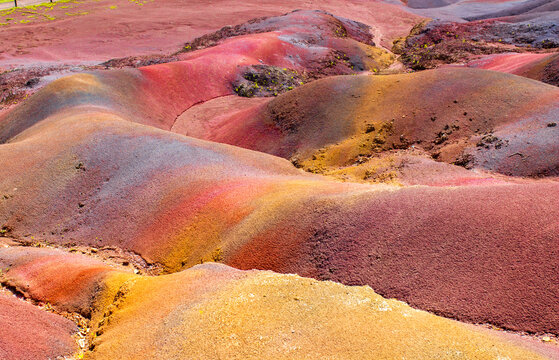 Chamarel Seven Colored Earth Geopark in Mauritius Island. Colorful panoramic landscape about this volcanic geological formation Chamarel Seven Colored Earth Geopark in Riviere noire district.