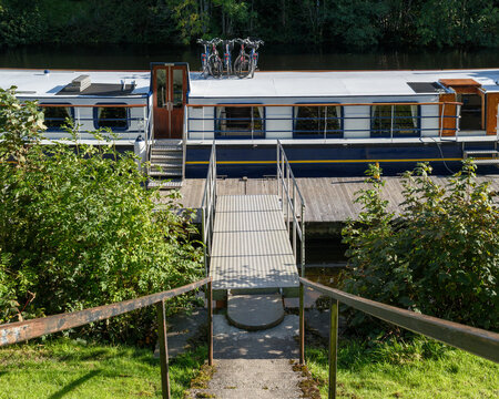 Cycles parked on the roof of a canal boat docked at a pier in Fort Augustus within the Highlands of Scotland near the waters of Loch Ness and Nessie