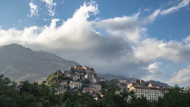 Historic centre in front of mountains, Corte, Corsica, France
