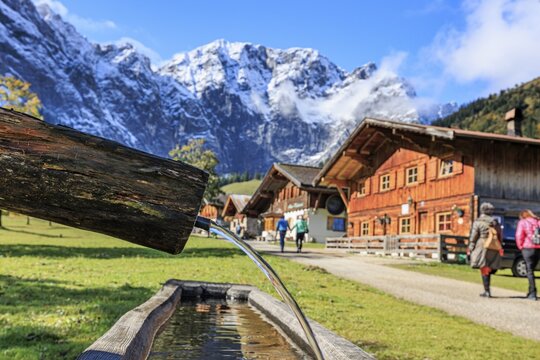 Fountain, snowy mountains, alpine pasture, autumn, maple trees, sunny, Engalm, Gro&szlig;er Ahornboden, Karwendel Mountains, Tyrol, Austria