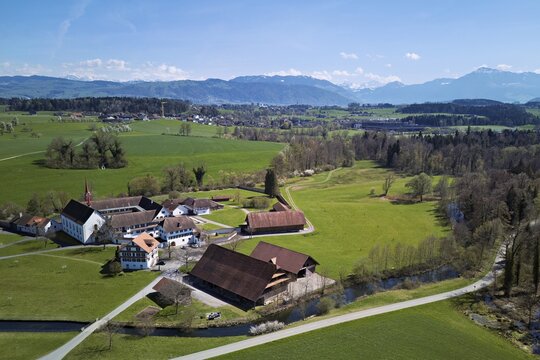 Frauenthal Cistercian Abbey, the oldest in Switzerland, with the Alps with the Rigi in the back, Hagendorn, Canton of Zug, Switzerland