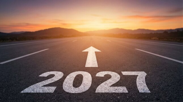 Sunset bathes an empty road ahead of 2027. Arrow points forward, guiding hope and progress. Asphalt shows worn yet determined surface. Distant hills frame the fading golden hour