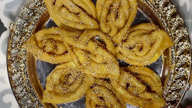 Griwech crunchy pastries , an Algerian dessert made with dough, fried and then coated with syrup and sesame seeds