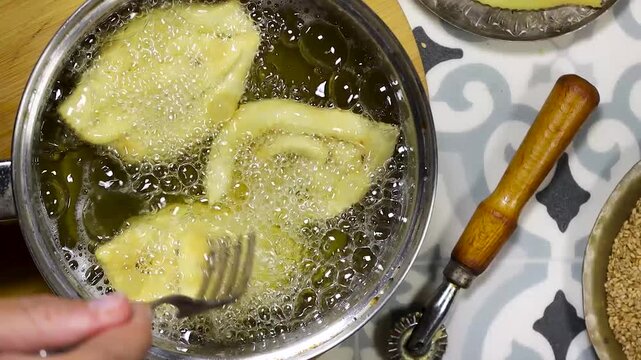 Griwech crunchy pastries , an Algerian dessert made with dough, fried and then coated with syrup and sesame seeds