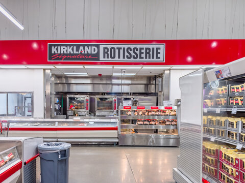 Calgary, Alberta, Canada. September 27, 2026. Interior view of a Kirkland Signature rotisserie counter inside a wholesale warehouse store.