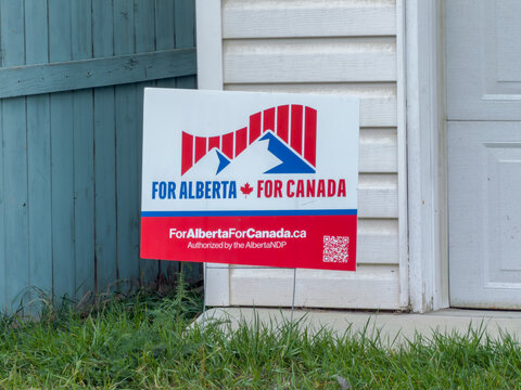Calgary, Alberta, Canada. September 27, 2026. For Alberta For Canada political campaign lawn sign leaning against a house exterior wall.