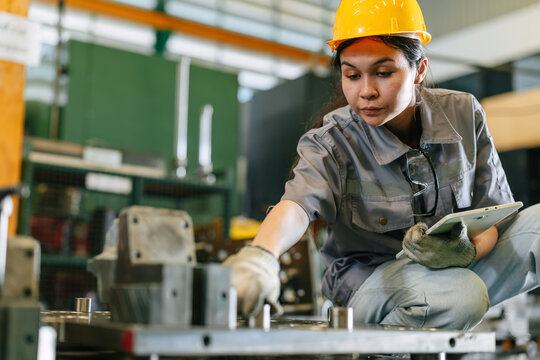 Young female factory engineer worker working intention in industrial in manufacturing plant