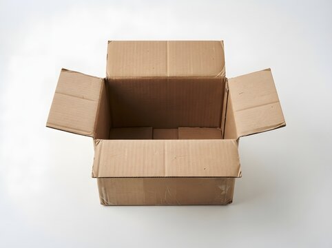 Open cardboard box on white background for shipping and packaging concepts