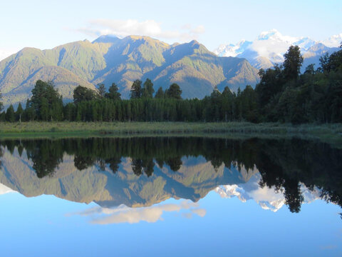 Stunning Mirror Reflection of Mount Cook and Mount Tasman in the Calm Waters of Lake Matheson, New Zealand