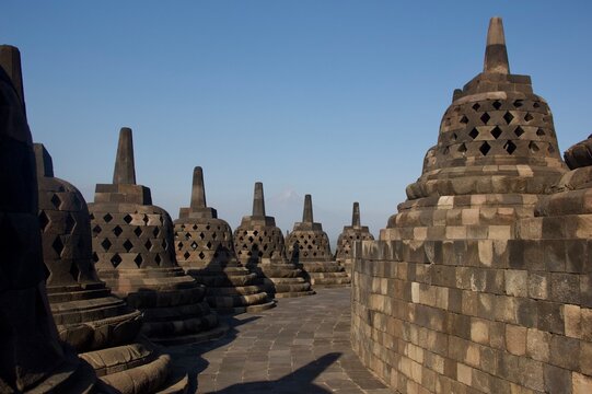 Stone Stupas at Borobudur Temple with Mount Merapi in the Distance