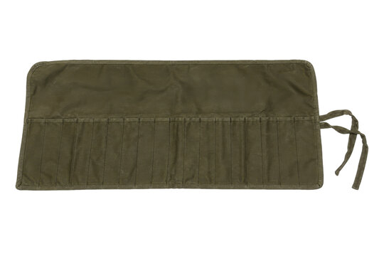 Empty olive green canvas tool roll with multiple pockets and tie straps is laid flat on a white background