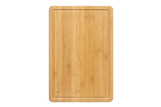Rectangular light brown bamboo cutting board with a groove, shot from a top-down perspective on a clean white background