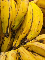 Ripe yellow plantains marked with black streaks along thick peel © Bugra Kaan Ersoy
