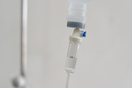 Close up set iv fluid intravenous drop saline drip for accident and seriously patient in hospital room.Medical treatment emergency patient.Medical treatment and cure concept.