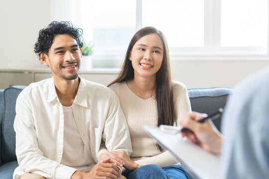 Psychology, Happy asian young woman and man couple love, consulting problem mental health together with psychologist at clinic, wife encouraging husband. Psychologist with patient sick mental therapy.