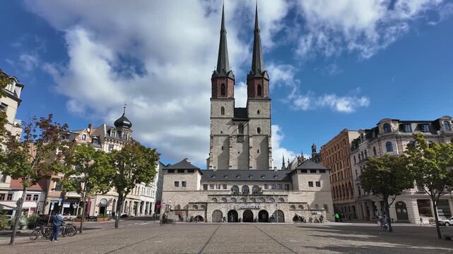 historical square &ldquo;Hallmarkt&rdquo; in Halle (Saale) downtown on a sunny day, wide angle time-lapse with motion blur, Saxony-Anhalt, Germany, 2026