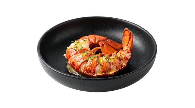 A succulent cooked lobster tail drizzled with golden butter sauce and fresh chives, served in a modern black bowl for gourmet restaurant menu design