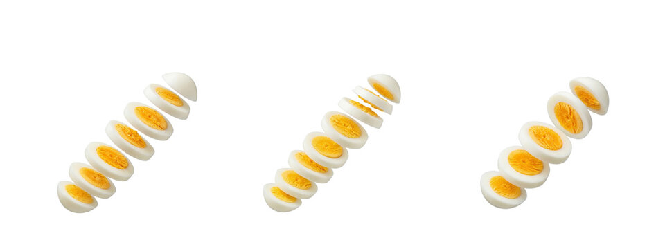 Three sets of sliced hard-boiled chicken eggs falling or flying in a diagonal composition, healthy protein food ingredient isolated on transparent background