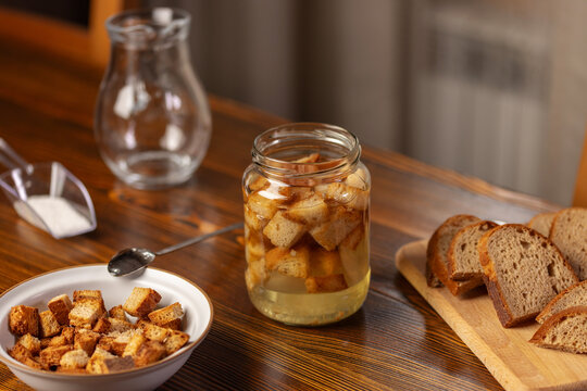 Homemade fresh kvass and bread on wooden background