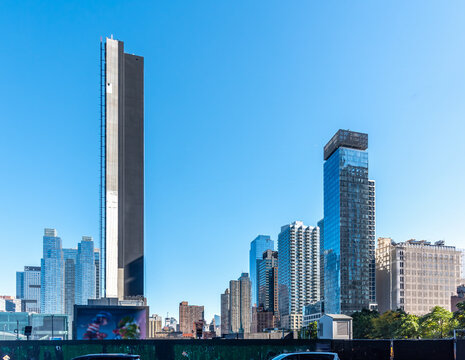 Manhattan skyscrapers under a blue sky in the morning