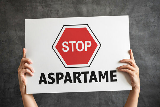 Stop aspartame sign held by hands photo illustration