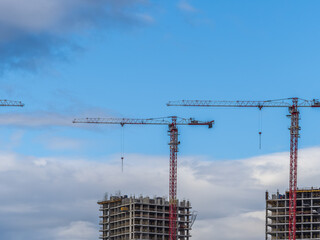 Tower crane at a construction site against the sky © Dmitrii Potashkin