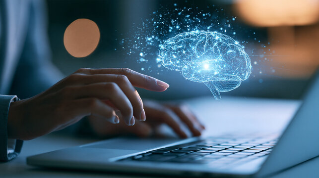 Hands typing on laptop keyboard with glowing blue digital brain hologram above, artificial intelligence and machine learning concept, futuristic technology and data innovation in modern workplace