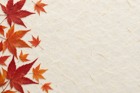 Japanese washi paper with pressed autumn maple leaves, copy space flat lay