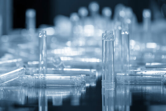 Healthcare plastic parts mass production by an injection molding process in a blue tone scene