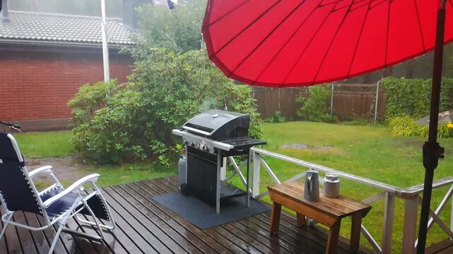 Barbecue on deck in heavy rain