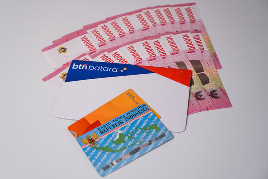 Makassar, Indonesia, September 20, A BTN Batara iB sharia savings book, a BTN debit card, and an Indonesian National Identity Card neatly arranged together above