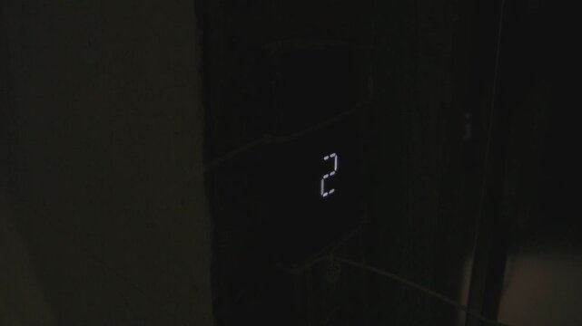Electronic countdown display progressing from numeric two to segmented circular indicator across