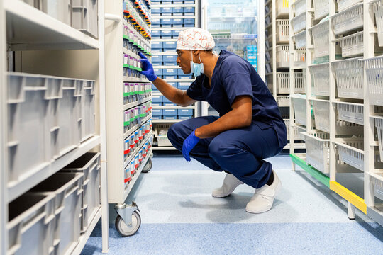 Medical professional managing inventory of hospital supplies