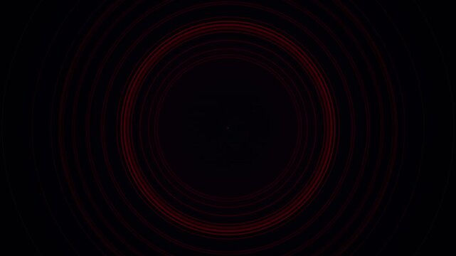 Abstract red circular technology rings pulsating on black background