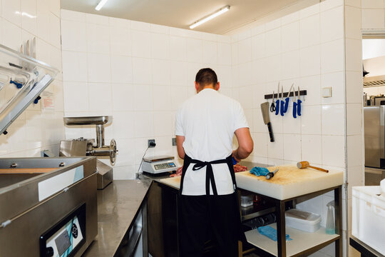 Restaurant Worker Preparing Raw Meat