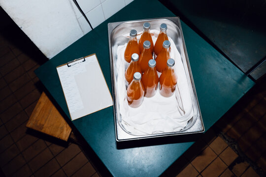 Bottled Orange Beverage in Restaurant Kitchen