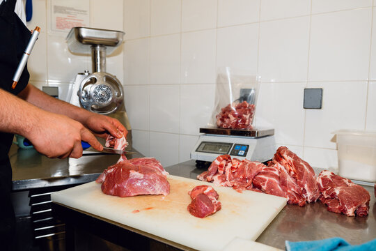 Portioning Raw Meat in Restaurant Kitchen