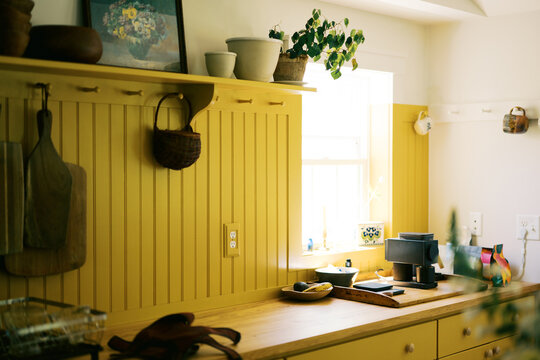 real imperfect kitchen with yellow cabinetry