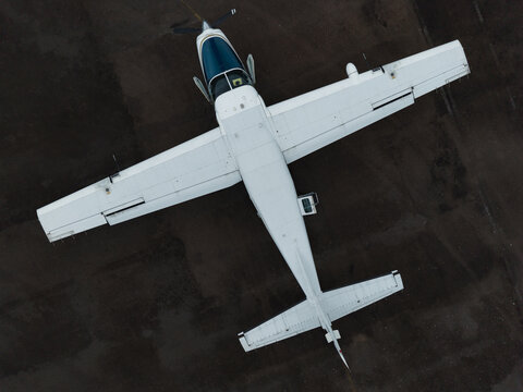 Aerial Top Down View of Small Turboprop Aircraft on Tarmac