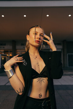 Tattooed Woman Posing at Cinema