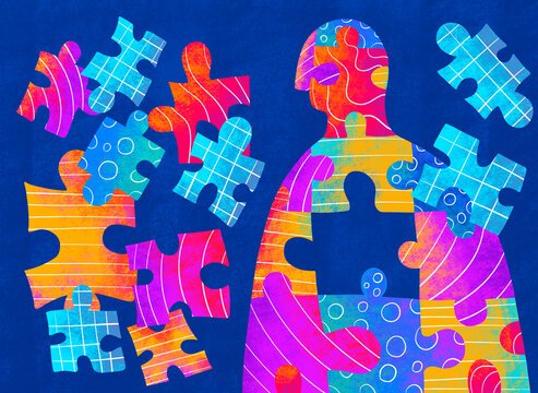 Person surrounded by colorful puzzle pieces in dark blue background
