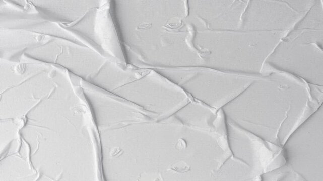 White crumpled paper background loop, blank wrinkled sheet. Old crumpled paper texture for vintage poster, creased note sheet mockup