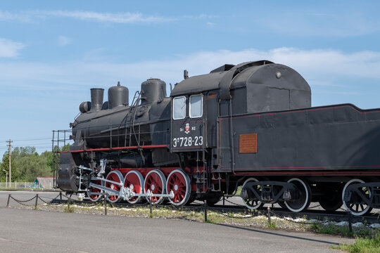DNO, RUSSIA - JUNE 15, 2025: Old Soviet steam locomotive Em728-23. A monument in honor of the labor and combat traditions of the railway workers of the Dno station. Pskov region