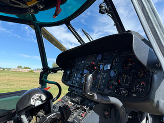 Helicopter cockpit with flight instruments and control panel © natgi