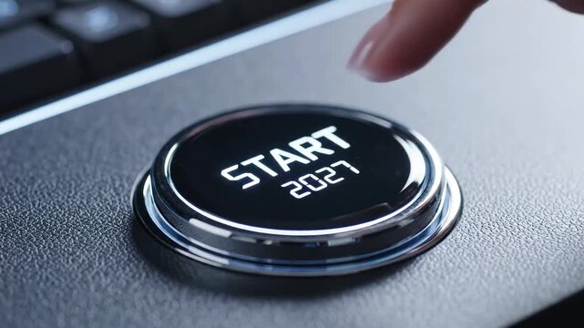 Close up of a finger pressing a glowing Start 2027 button on a dark modern interface for New Year business launch and future concept