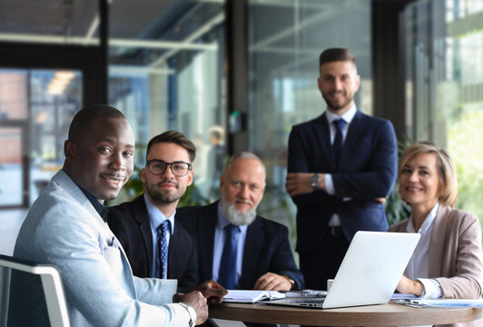 Portrait of a positive business employees at an office business meeting.