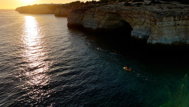 Sunset over stunning cliffs and arches Algarve, Portugal 