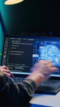 Man programming artificial intelligence on laptop - Using ai on laptop