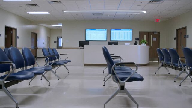 Healthcare waiting room and hospital lobby empty medical facility interior with rows of chairs and reception desk clinical environment b-roll