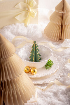 White festive table display with charming baubles.
